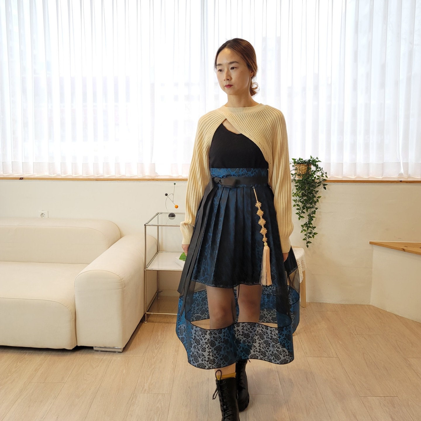 Elegant Layered Mesh High-Low Skirt with Tassel Detail and Patterned Hem